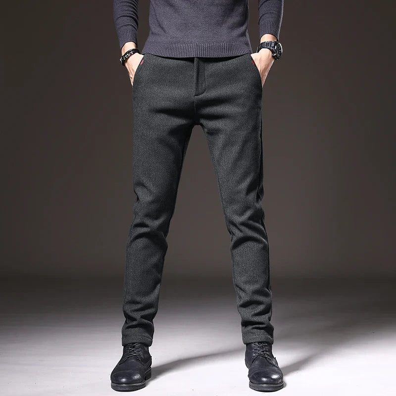 Black modern fit stretch dress pants for men, providing comfort and style.