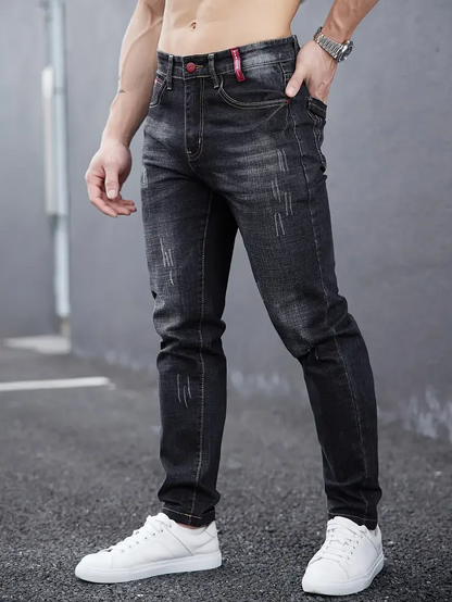 Slim-fit men's tapered jeans in black, perfect for a modern casual style.