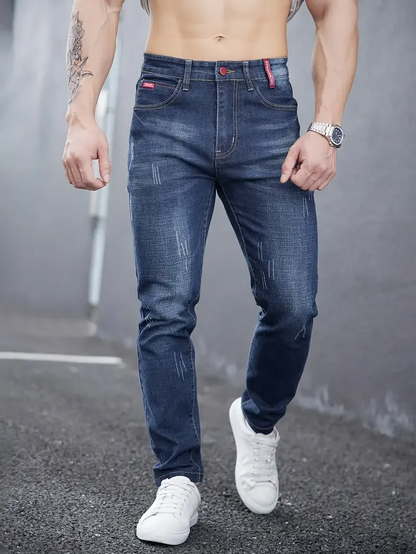 Everyday casual blue men's tapered jeans, providing a comfortable modern slim fit.