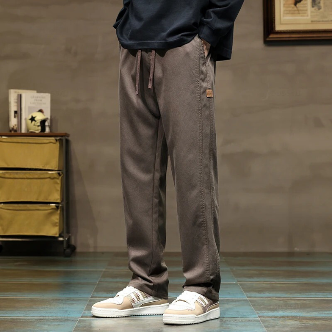 Stylish gray men's relaxed drawstring pants. Versatile for lounge, casual wear, & men's fashion.