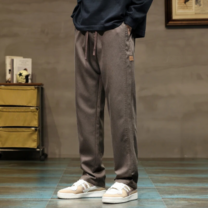 Stylish gray men's relaxed drawstring pants. Versatile for lounge, casual wear, & men's fashion.
