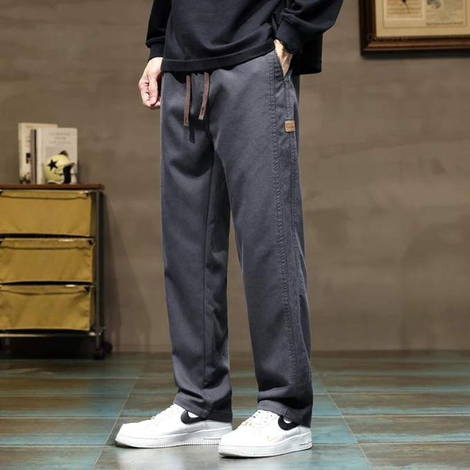 Men's stylish black drawstring pants, relaxed fit. Ultimate comfort & adjustable waist for men's fashion.