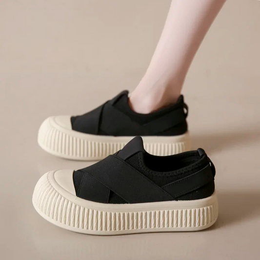 Black Seraphine platform loafers for women. Comfortable, trendy slip-on footwear for a modern casual style.