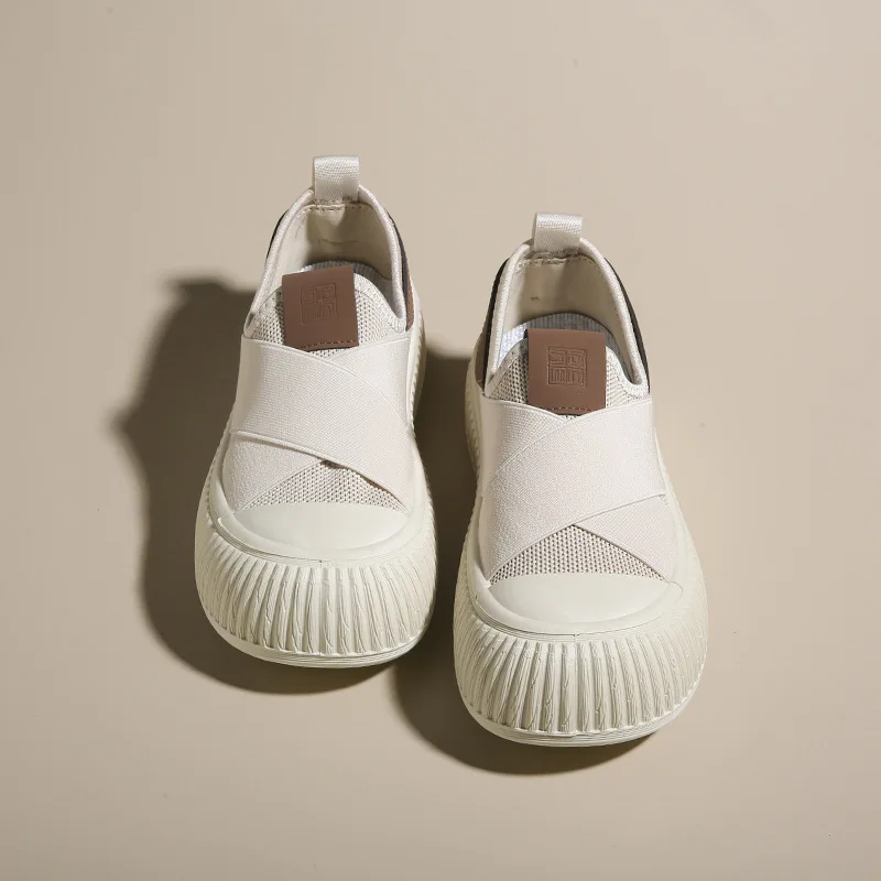Women's Seraphine platform loafers in black & white. Comfortable, trendy slip-on footwear for modern style.