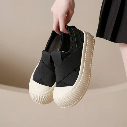 Stylish black women's Seraphine platform loafers. Comfortable slip-on shoes, ideal for a trendy modern look.