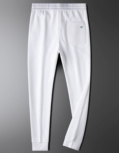 Black unisex relaxed fit pants, comfortable and versatile for casual wear and everyday style. Easy care.