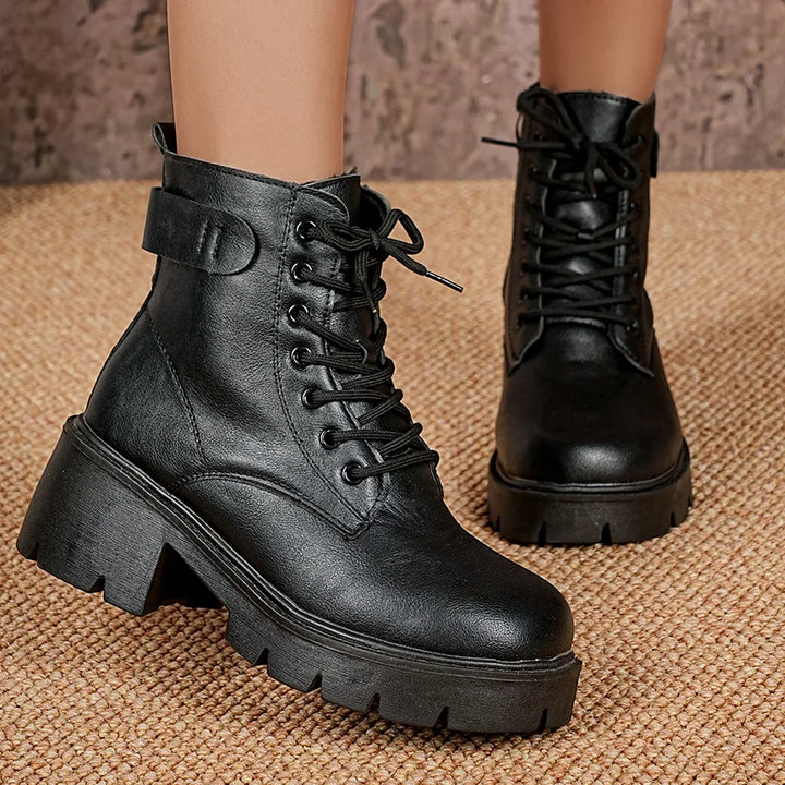 Comfortable & durable black women's chunky ankle boots with lace-up design and lug sole for edgy winter style.