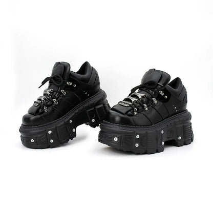 Durable black leather-look women's punk platform boots featuring a prominent lace-up and thick sole.