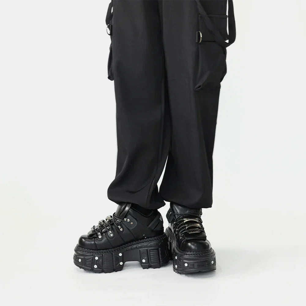 Statement women's black punk platform boots. Lace-up, bold design for edgy, rebel footwear and fashion.