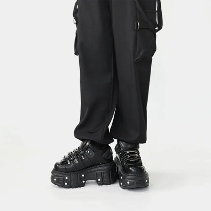 Statement women's black punk platform boots. Lace-up, bold design for edgy, rebel footwear and fashion.