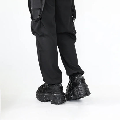 Trendy women's black punk platform boots, featuring a sturdy platform sole and intricate lace-up detailing.
