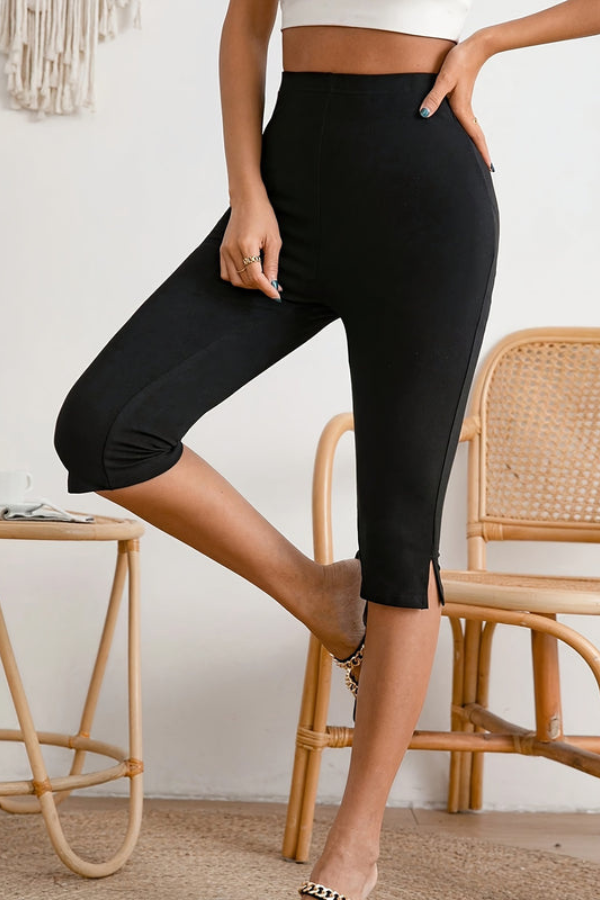 Close-up of women's black stretch cropped pants fabric, highlighting the comfortable slim-fit and quality material.