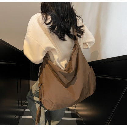 Khaki stylish handbag for women, a spacious crossbody with an organizer pocket.