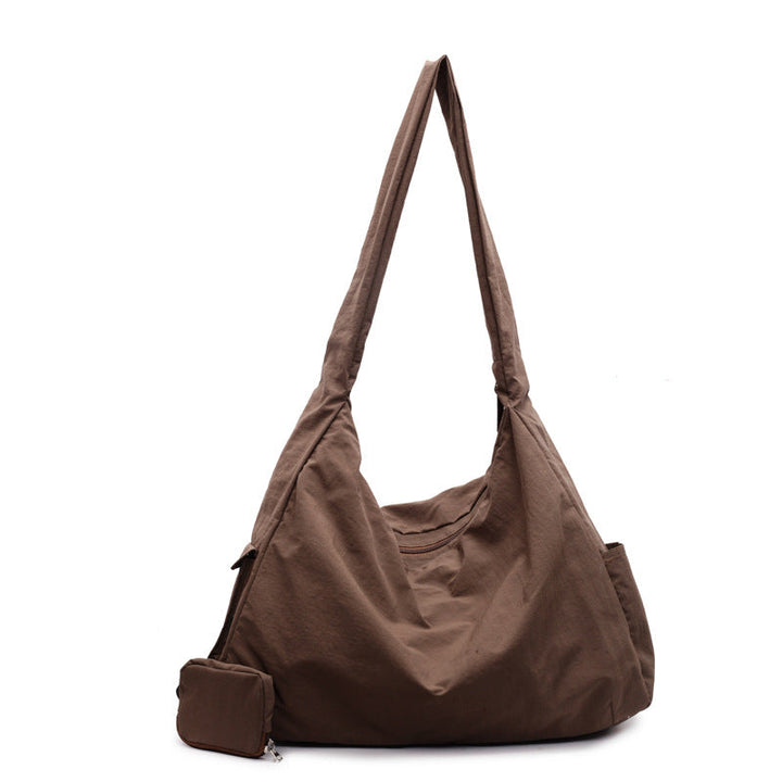 Women's black large capacity crossbody bag, practical organizer pocket for daily essentials.