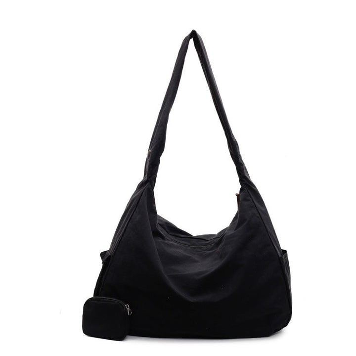 Green versatile women's shoulder bag, spacious and stylish with an integrated organizer.