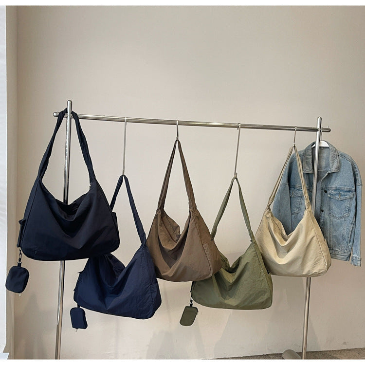 Coffee versatile crossbody bag with organizer, ideal as a travel accessory for women.