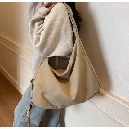 Khaki large capacity crossbody bag, perfect for women needing versatile travel storage.
