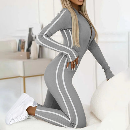 Fashionable black women's Velocity lounge jumpsuit. Chic one-piece activewear & casual outfit for modern comfort.
