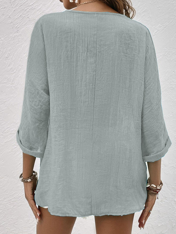 Green versatile women's V-neck long sleeve button-down blouse for casual everyday wear.