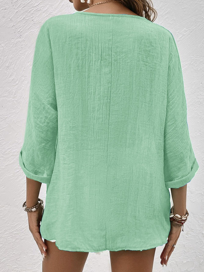 Stylish women's V-neck long sleeve button-down shirt, a chic top for varied occasions.