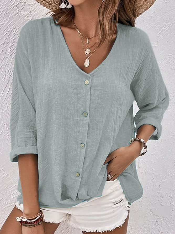 Comfortable women's relaxed fit V-neck long sleeve button-down shirt, ideal for daily wear.
