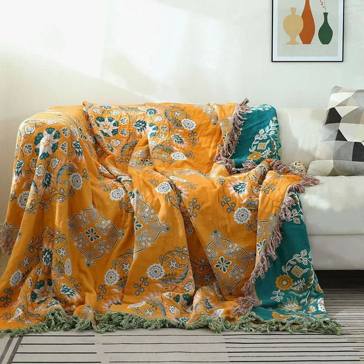 Unisex bohemian cotton throw on a bed, adding a cozy and decorative accent to bedroom decor. Soft all-season blanket.