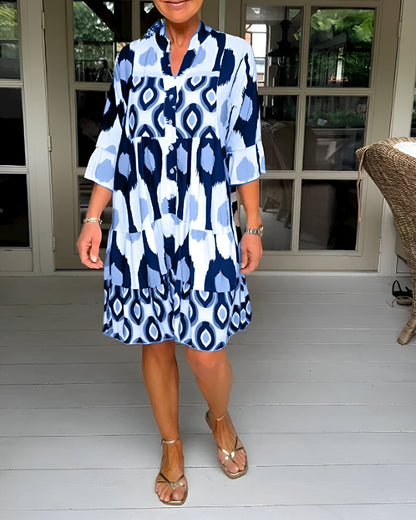 Flowing women's tiered maxi dress with bohemian style, mandarin collar & ruffle cuffs. Great for summer vacations.