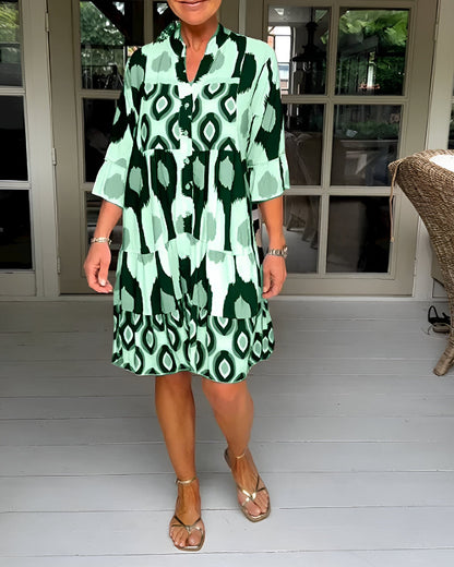 Women's bohemian tiered maxi dress, comfortable and stylish with geometric print and ruffle cuffs for spring/summer.