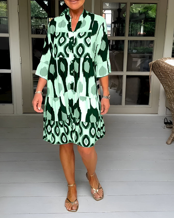 Women's bohemian tiered maxi dress, comfortable and stylish with geometric print and ruffle cuffs for spring/summer.
