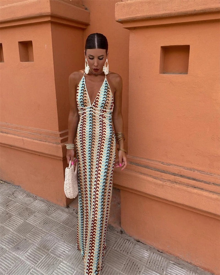Women's elegant bohemian V-neck halter maxi dress with vibrant print, ideal for wedding guests & vacation.