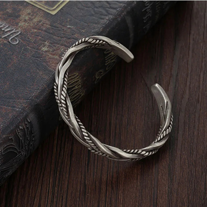 Adjustable sterling silver cuff bracelet for men, featuring a bold twisted design.