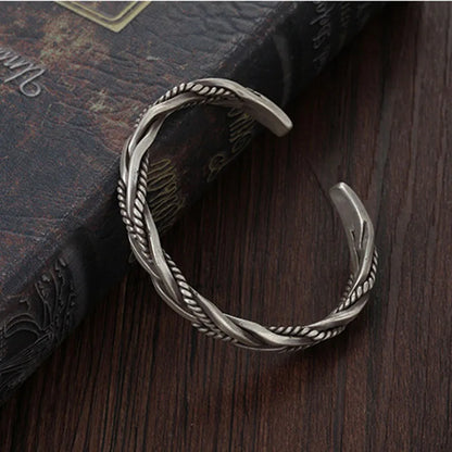 Adjustable sterling silver cuff bracelet for men, featuring a bold twisted design.