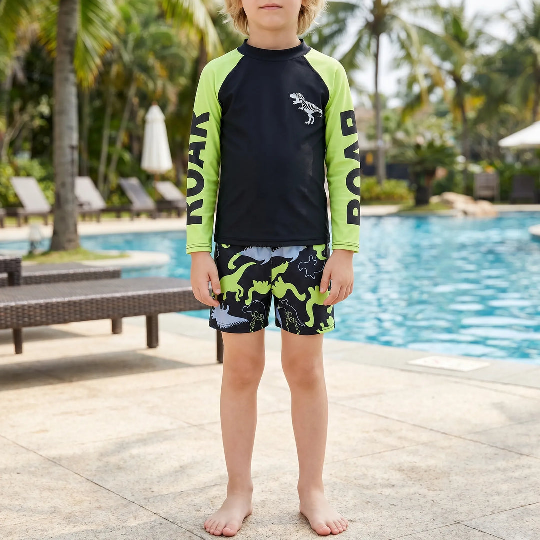 Boys' dinosaur rash guard swim set with long sleeve top & matching swim shorts. Perfect for beach & pool.