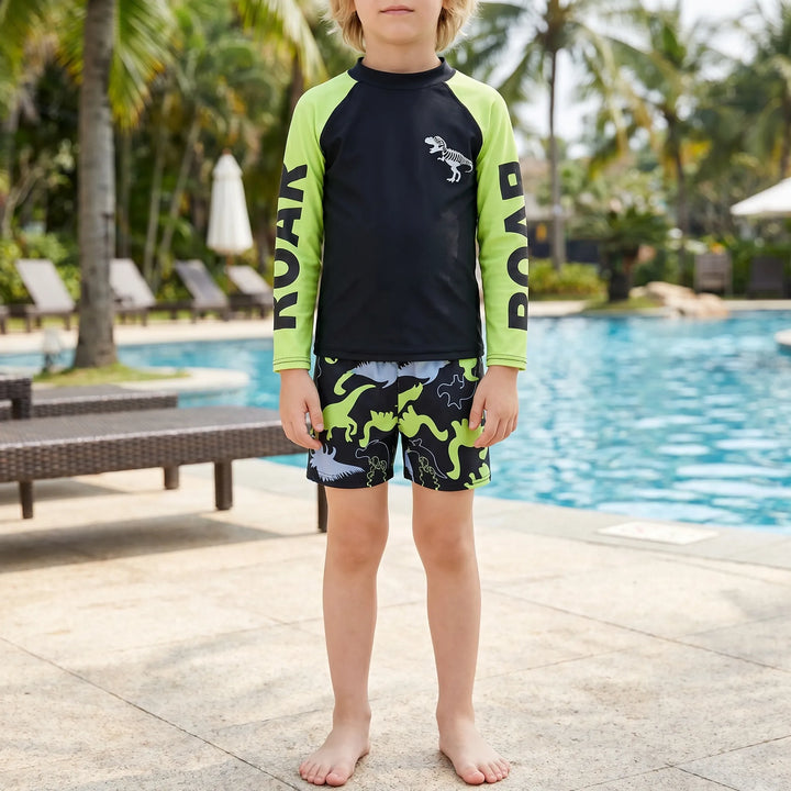 Boys' dinosaur rash guard swim set with long sleeve top & matching swim shorts. Perfect for beach & pool.
