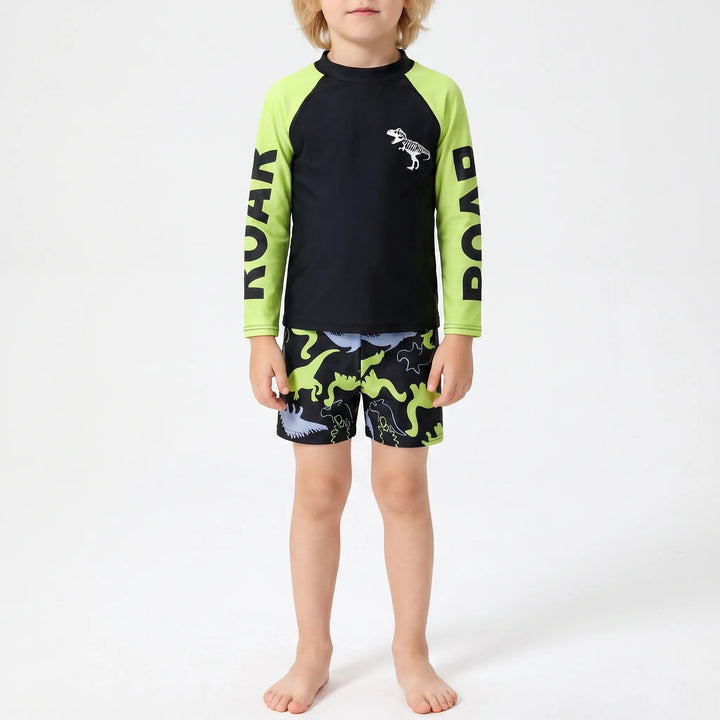 Active boys' dinosaur rash guard and swim shorts set for summer fun, ideal for beach trips & pool play.