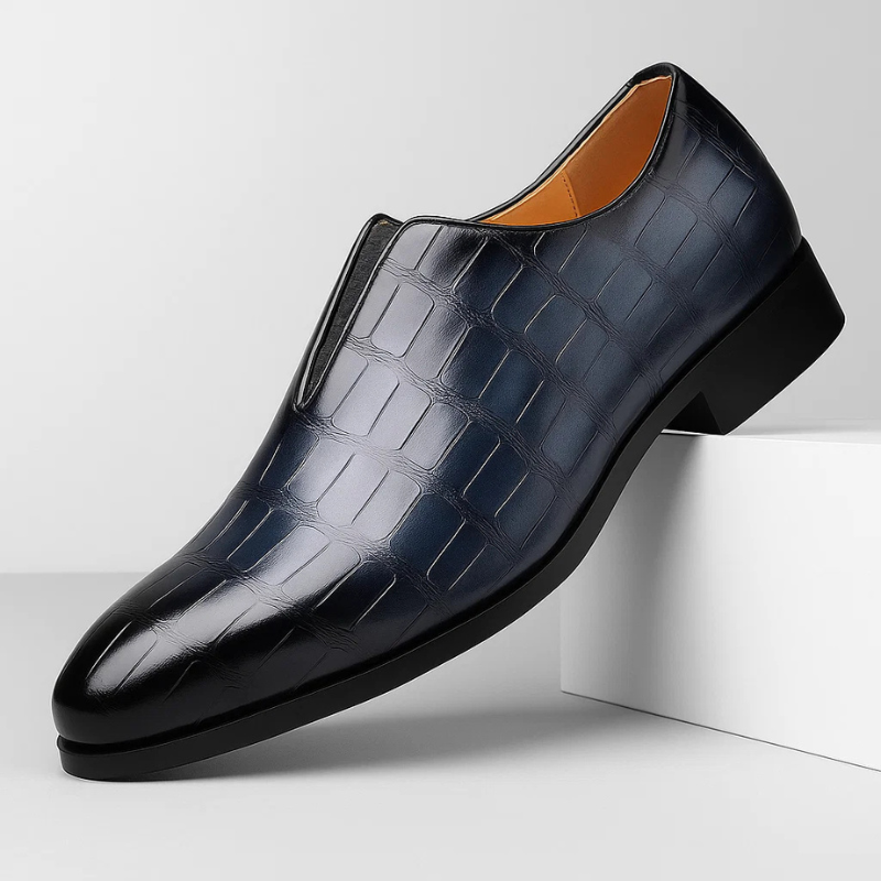 Casual navy blue men's loafers, croc-embossed, offering both style and comfort.