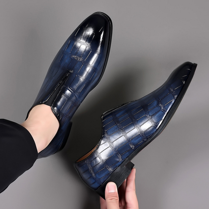 Navy blue versatile croc-embossed loafers for men, great for casual or formal events.