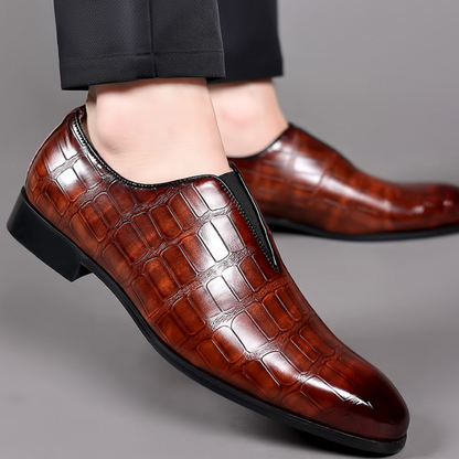 Sophisticated brown croc-embossed men's loafers, perfect for dress or casual wear.
