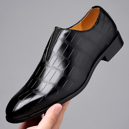 Stylish black men's loafers with croc texture, ideal for sophisticated outfits.