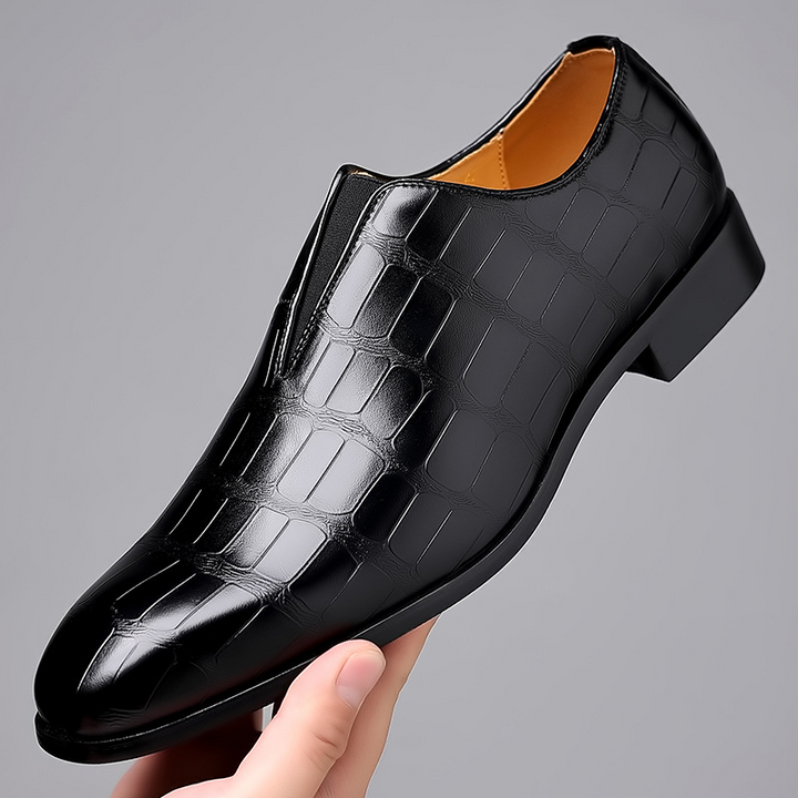Stylish black men's loafers with croc texture, ideal for sophisticated outfits.