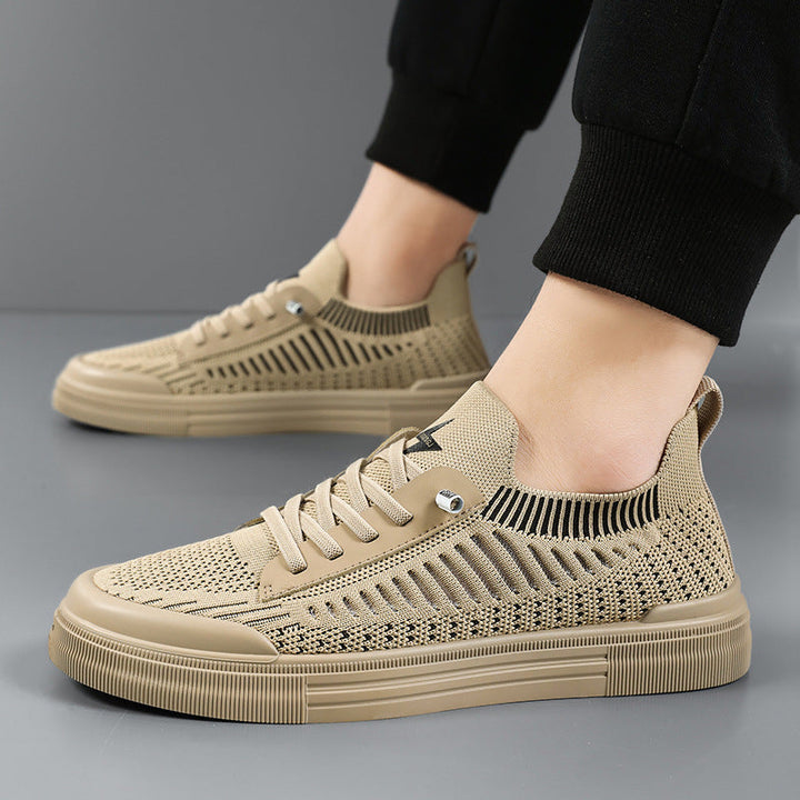 Gray casual men's sneakers, offering lightweight comfort for walking & daily wear.