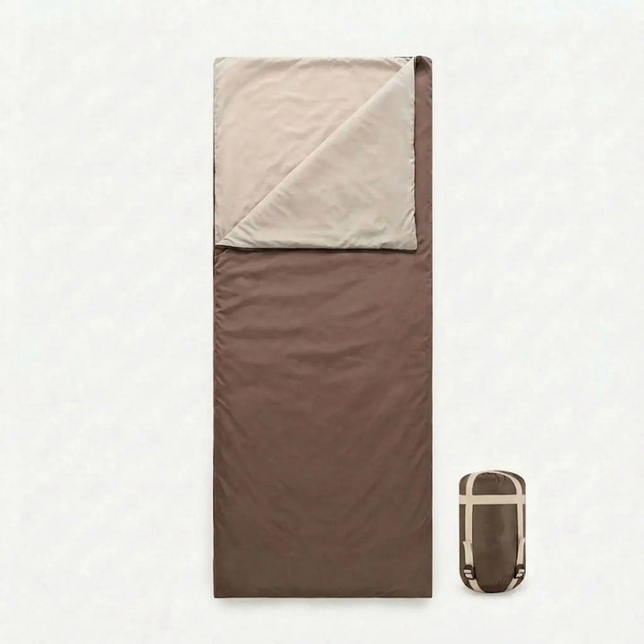 Unisex brown envelope sleeping bag open, ready for a cozy night camping or hiking. Compact and lightweight for travelers.