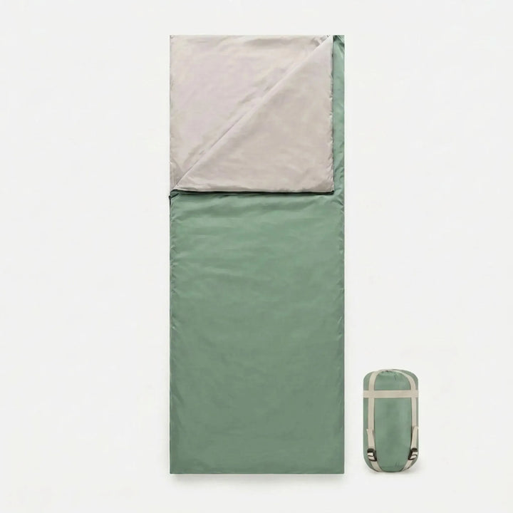 Compact brown envelope sleeping bag with stuff sack, perfect for backpackers and lightweight camping & hiking adventures.
