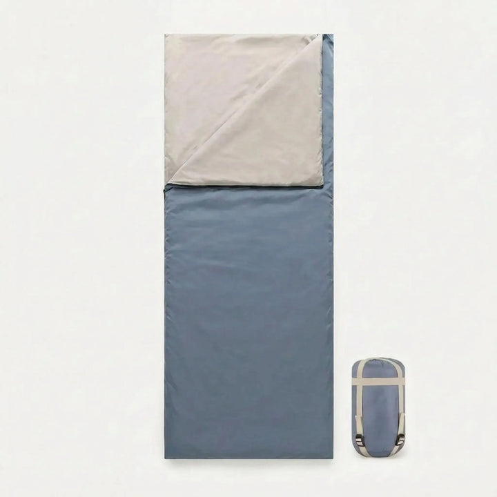 Versatile brown envelope sleeping bag for spring/summer camping, hiking, and outdoor adventures. Unisex & compact.