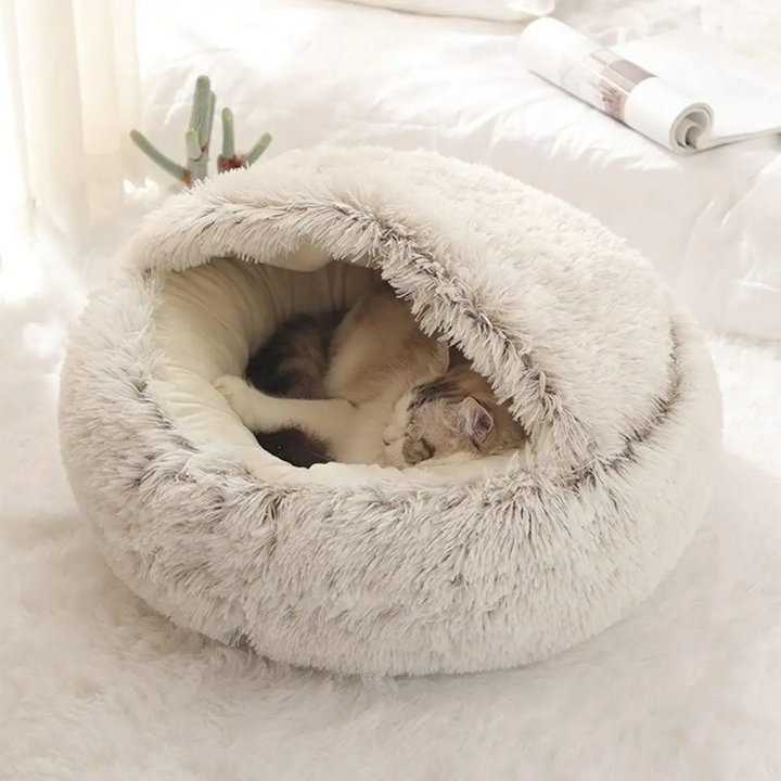 Calming dog bed with high walls for a cozy cave feel. Promotes deep relaxation & reduces pet anxiety.