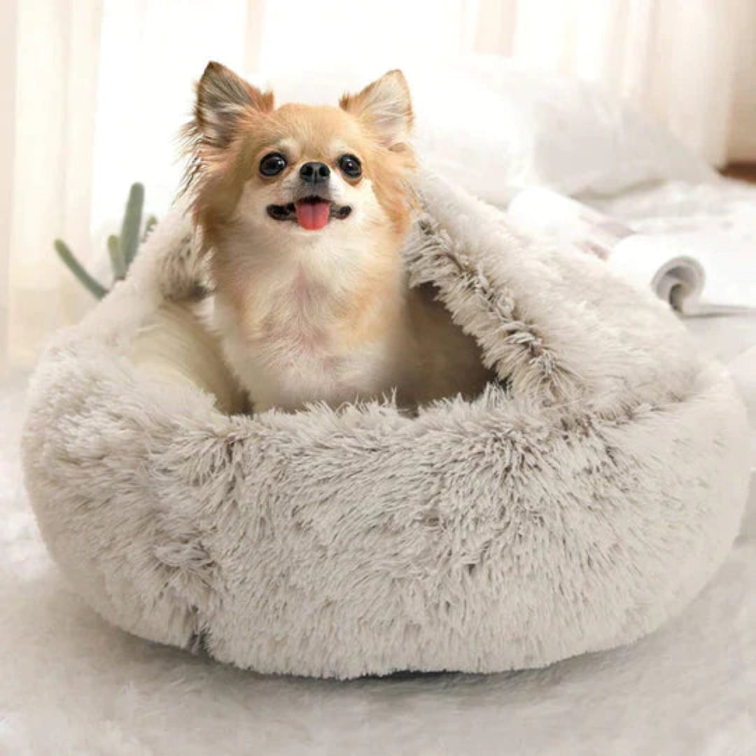 Luxury plush dog bed provides anxiety relief, promoting deep sleep and ultimate dog comfort in a cozy cave.