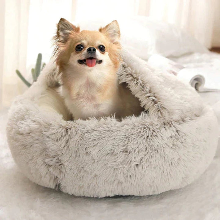 Luxury plush dog bed provides anxiety relief, promoting deep sleep and ultimate dog comfort in a cozy cave.