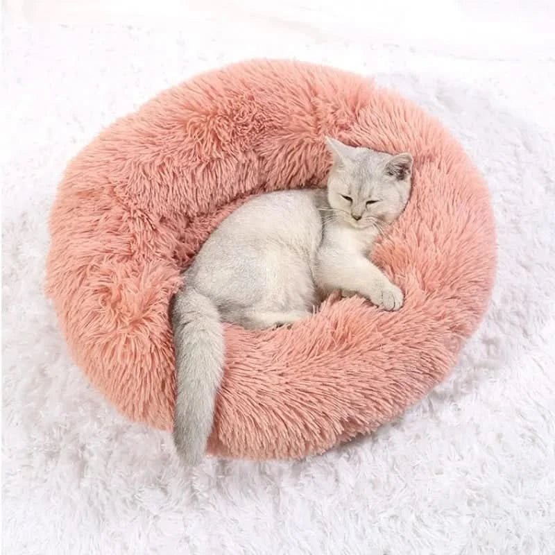 Machine washable calming dog bed. Durable & ultra-soft pet lounger offers cozy support & anxiety relief.