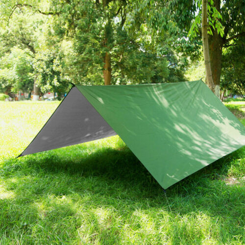 Dual-layer camping hammock with detachable rainfly and mosquito net shown in forest.