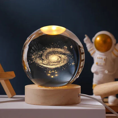 Magical glowing sphere night light, 3D engraved universe design for serene space decor.